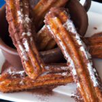 Indulge in Chocolate-Filled Churros with Cinnamon Sugar Bliss