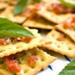 Fresh Bites: Diced Tomatoes and Basil Topping Crackers
