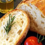 Rustic Italian Bread with Rosemary, Tomatoes & Olive Oil Flair
